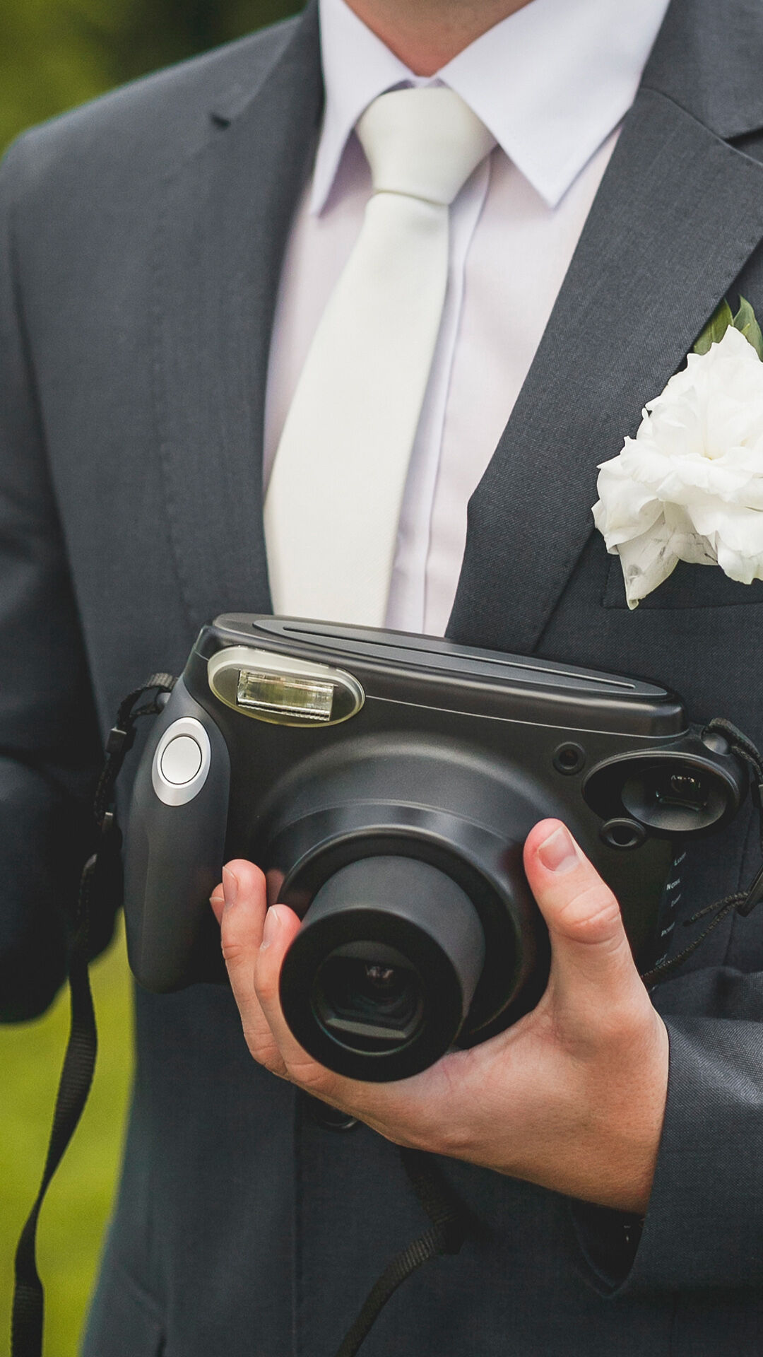 Professional wedding photographer ready to capture beautiful moments with his camera